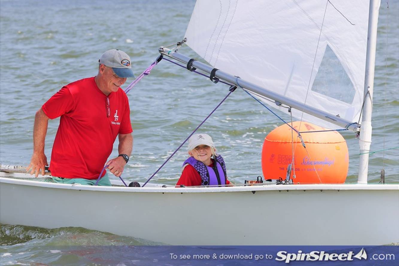 Joe and granddaughter Olivia Brooks enjoying time together sailing a Penguin.